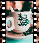 A close-up shot of Ipoh White Coffee highlighting its smooth, creamy texture with a slight hint of caramel, brewed in the traditional Malaysian way.